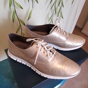Gold Cole Haan sneakers